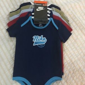 Nike baby bodysuits.